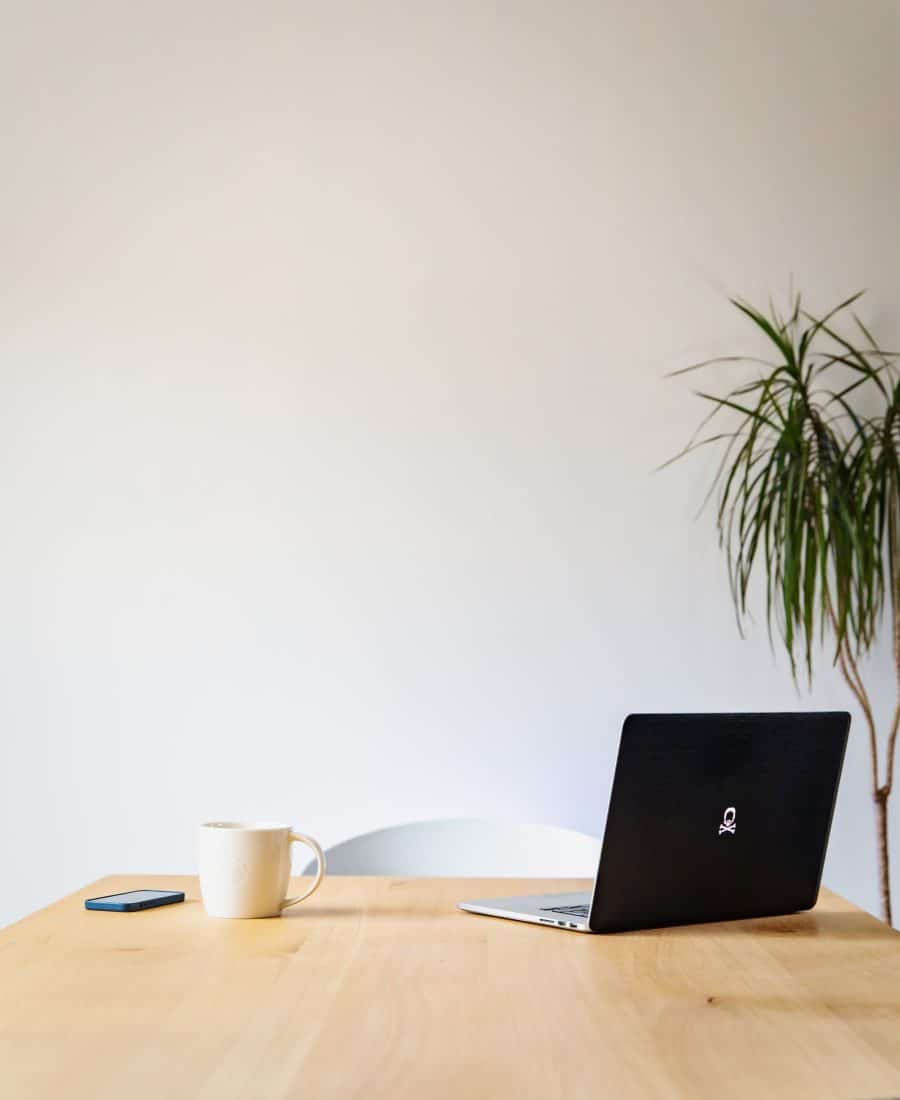 Table with a laptop for the contact page apartments in decatur Panthersville-geert-pieters-XAg7CqxcIx4-unsplash